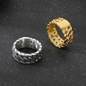 Macro detail of men's Cuban chain ring showing 316L stainless steel texture and engraving