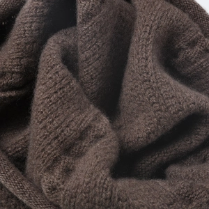 Deep brown jacquard wool knit beanie with thick thermal texture and soft ribbed finish