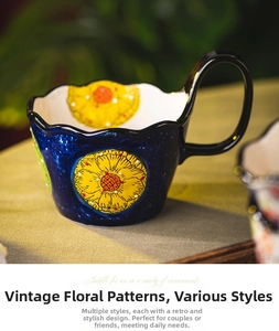 Close-up of vintage ceramic mug with hand-painted yellow flowers and blue glaze
