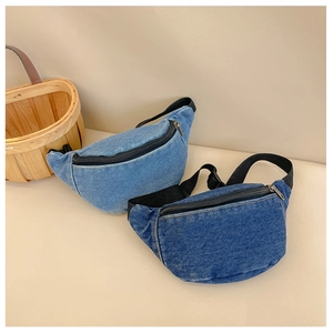 Detail view of denim waist bags in light and dark blue with durable metal zippers