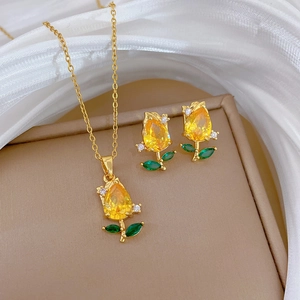 Champagne gold rose jewelry set with sparkling crystals on necklace and earrings