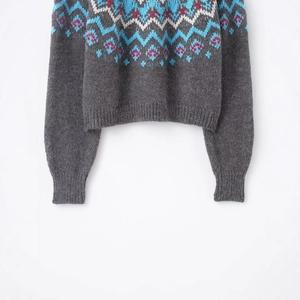 Dark grey Fair Isle knit sweater featuring colorful jacquard patterns and ribbed trims
