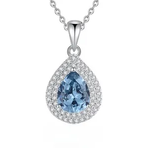 Detailed view of S925 silver necklace with pear-shaped blue emerald and zircon halo