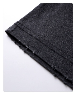 Macro shot of double-needle stitching and distressed edge detail on grey cotton t-shirt