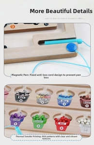 Detailed macro of wooden magnetic maze toy with colorful cupcake number sorting graphics