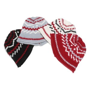 Detailed knit texture of four Fair Isle beanies in black, grey, white and red colors