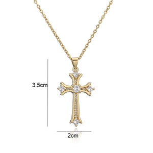 Detailed view of gold cross necklace with zircons measuring 3.5cm by 2cm dimensions