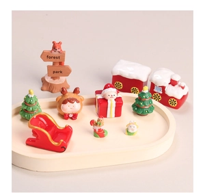 Collection of Christmas resin miniatures including Santa, reindeer and train on tray
