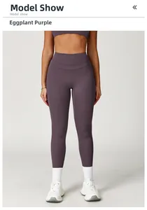 Front view of high-waist yoga pants in eggplant purple brushed fabric on model