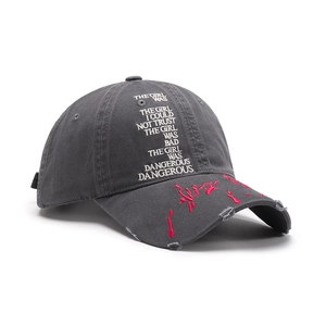 Distressed charcoal grey baseball cap with embroidery and red paint splatter effect