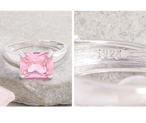 Macro detail of S925 hallmark on silver ring band with pink zircon gemstone