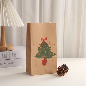 Brown kraft paper Christmas gift bag with festive tree print and rustic pine cones