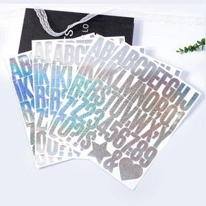Macro shot of 2-inch laser glitter alphabet and number stickers for DIY party decor