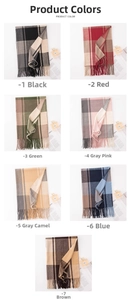 Detail view of plaid scarves in seven colors with fringed edges and soft cashmere texture