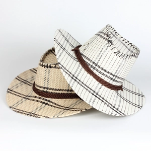 Detail of woven straw cowboy hats showing tight texture and brown decorative rope trim