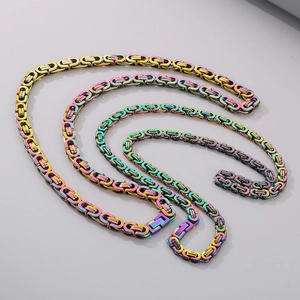 Macro detail of rainbow stainless steel Byzantine chain necklace with vibrant metallic luster