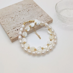 Double-layered baroque pearl necklace with heart-shaped shell beads and gold metal accents