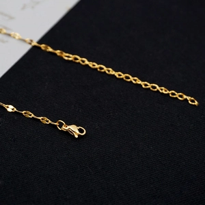 Minimalist gold link necklace with lobster clasp and adjustable extension chain detail