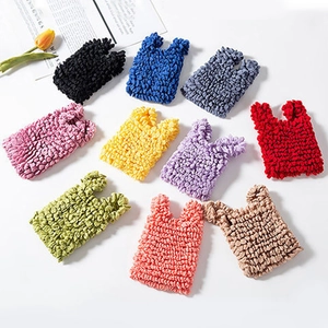 Flat lay of colorful textured bubble bags in ten various shades on white background
