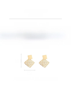 Detailed view of hollow geometric golden earrings with mesh texture and silver posts