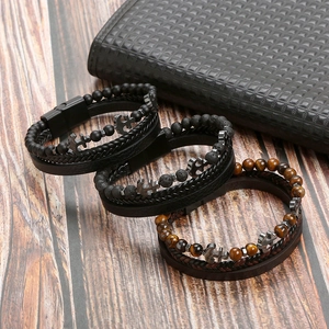 Close-up of handmade multi-layer leather bracelet with anchor charm and magnetic clasp