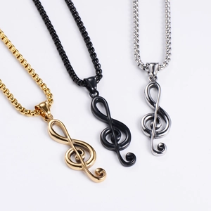 Minimalist treble clef pendant necklaces in gold, black, and silver with box chains