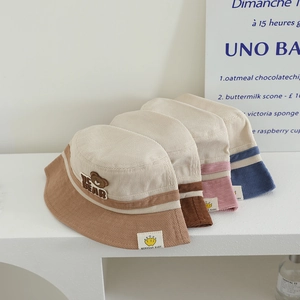 Kids corduroy bucket hats with bear patch in khaki, brown, pink, and beige blue