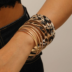 Vintage leopard print multi-layer bracelet set with gold bangles and rhinestone accents