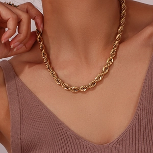 Close-up of 18K gold plated stainless steel chunky rope chain necklace on model