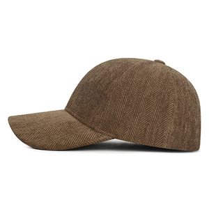 Classic brown baseball cap with herringbone texture and six-panel crown on white background