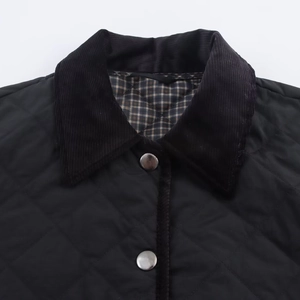 Women's black quilted corduroy jacket with diamond pattern and classic plaid lining
