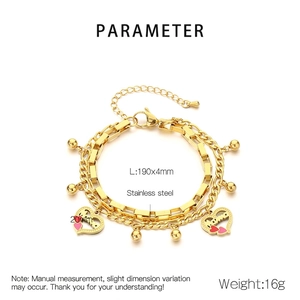 Detail of gold double-layer stainless steel bracelet featuring Mama heart pendants