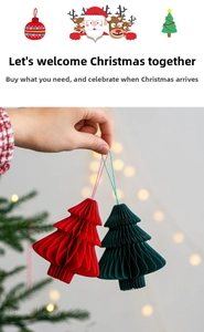 Detailed view of red and green honeycomb paper Christmas tree ornaments for hanging
