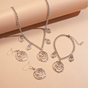Silver hollow flower jewelry set including necklace and bracelet on display