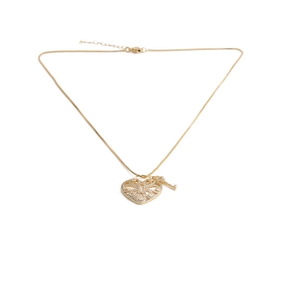 Detail of gold heart lock necklace featuring a key charm and sparkling zircon stones