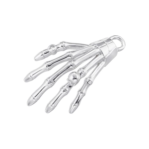 Close-up of a silver skeleton hand pendant featuring a skull wrist and gemstone detail