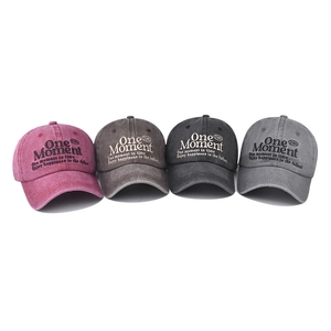 Vintage washed cotton baseball caps with One Moment embroidery in four classic colors