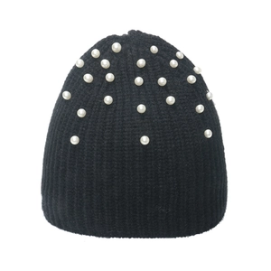 Classic black knitted beanie with white pearl accents and vertical ribbed texture on white back