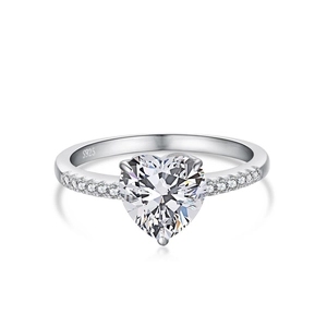 Detail of S925 sterling silver ring featuring a heart-cut diamond and pavé side stones