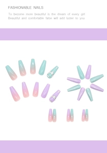 Detail of long coffin press-on nails with mint green and lavender purple gradient with rhinestones