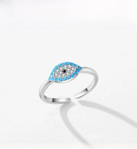 Detail of s925 silver evil eye open ring with turquoise stones and adjustable band
