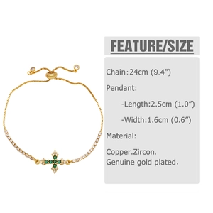 Detail of adjustable gold cross bracelet featuring green zircon and white crystal inlay