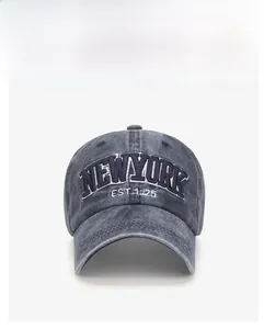 Front view of washed dark gray vintage baseball cap with white New York embroidery