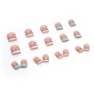 Cute pink and light blue press-on toenails with heart and star patterns for summer