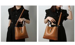 Detail of brown tote bag featuring textured faux crocodile skin and smooth leather panels