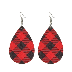 Detail of tear drop earrings with classic red and black buffalo plaid leather texture