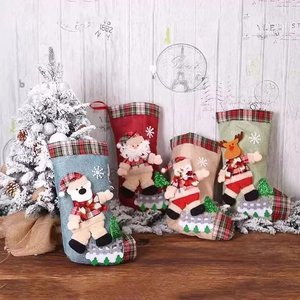 Set of four Christmas stockings with 3D felt characters including Santa and reindeer