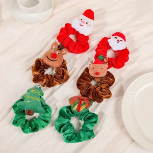 Set of six festive Christmas velvet scrunchies with reindeer and Santa Claus designs