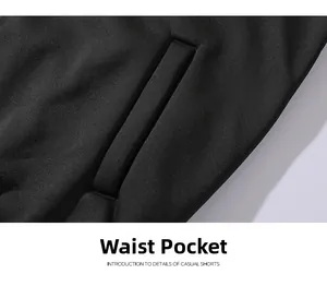 Macro detail showing the waist pocket and textured fabric of black casual sports shorts