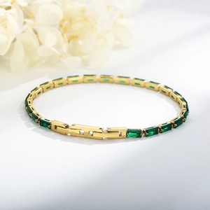Elegant gold titanium steel bracelet with rectangular green zircon and pavé setting